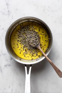 Combine honey and lavender buds in a small saucepan over low heat