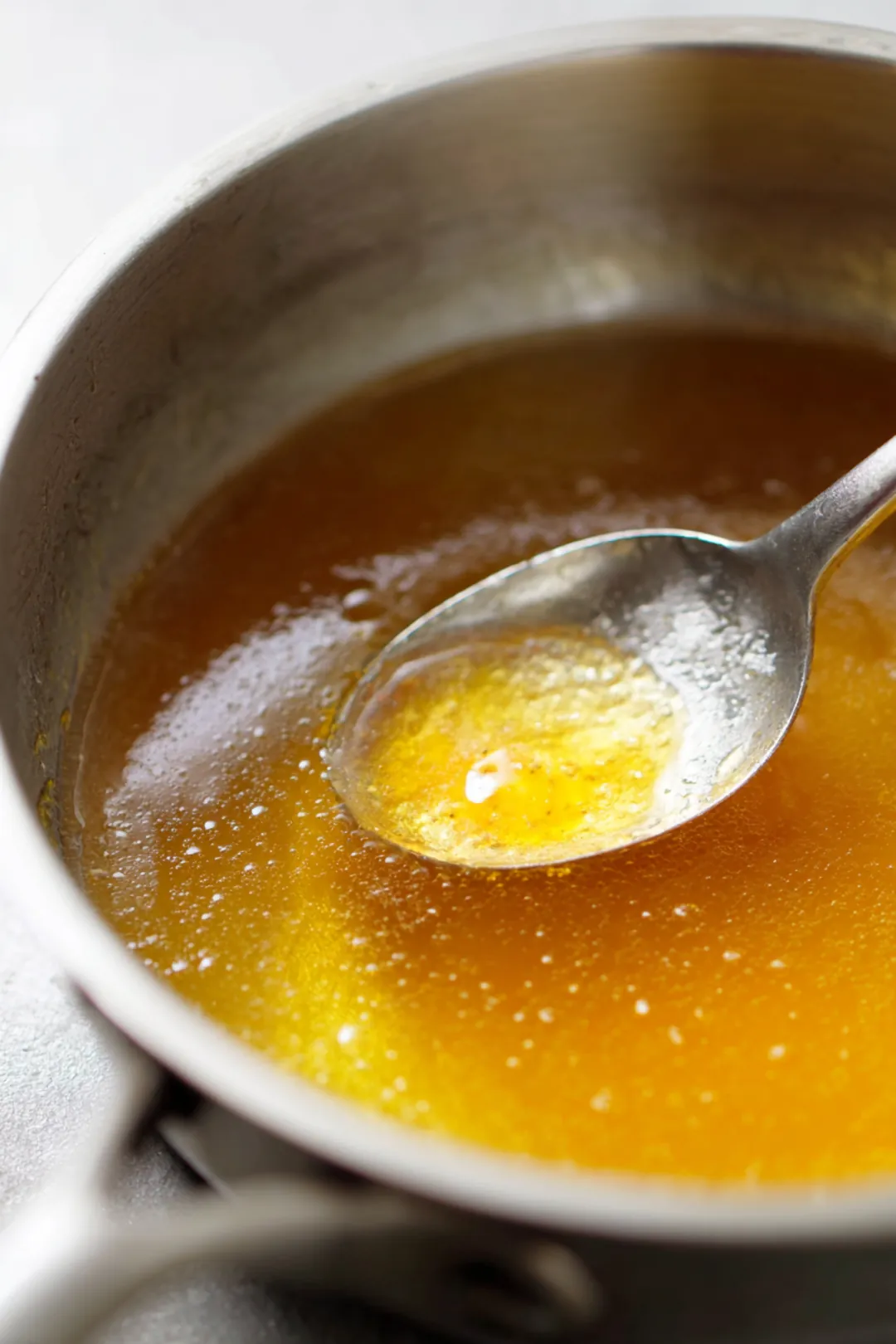 Combine lukewarm water, honey, and fruit juice in a saucepan