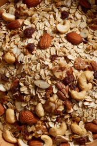Combine rolled oats, mixed nuts, honey, cinnamon, and salt in a large mixing bowl.