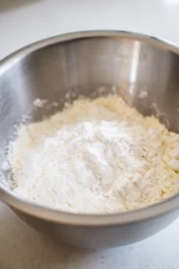 Combine the all-purpose flour, sugar, and baking powder in a mixing bowl