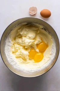 Combine the cream cheese and sugar in a large mixing bowl and beat until smooth