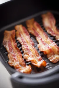 Cook bacon in air fryer until crispy