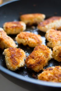 Cook breaded salmon bites in vegetable oil until golden brown