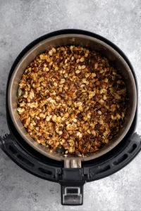 Cook granola in air fryer until golden brown and crunchy