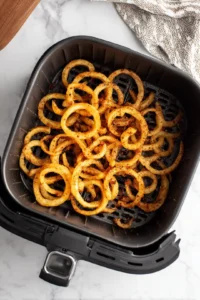 Cook seasoned curly fries in air fryer
