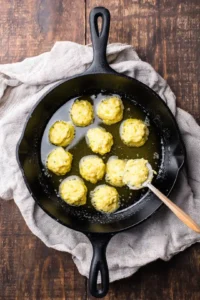 Cook the fritters until golden brown and crispy