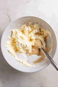 Cream together butter, sugar, eggs, and vanilla extract