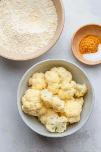 Dip cauliflower florets in batter and coat with breadcrumbs