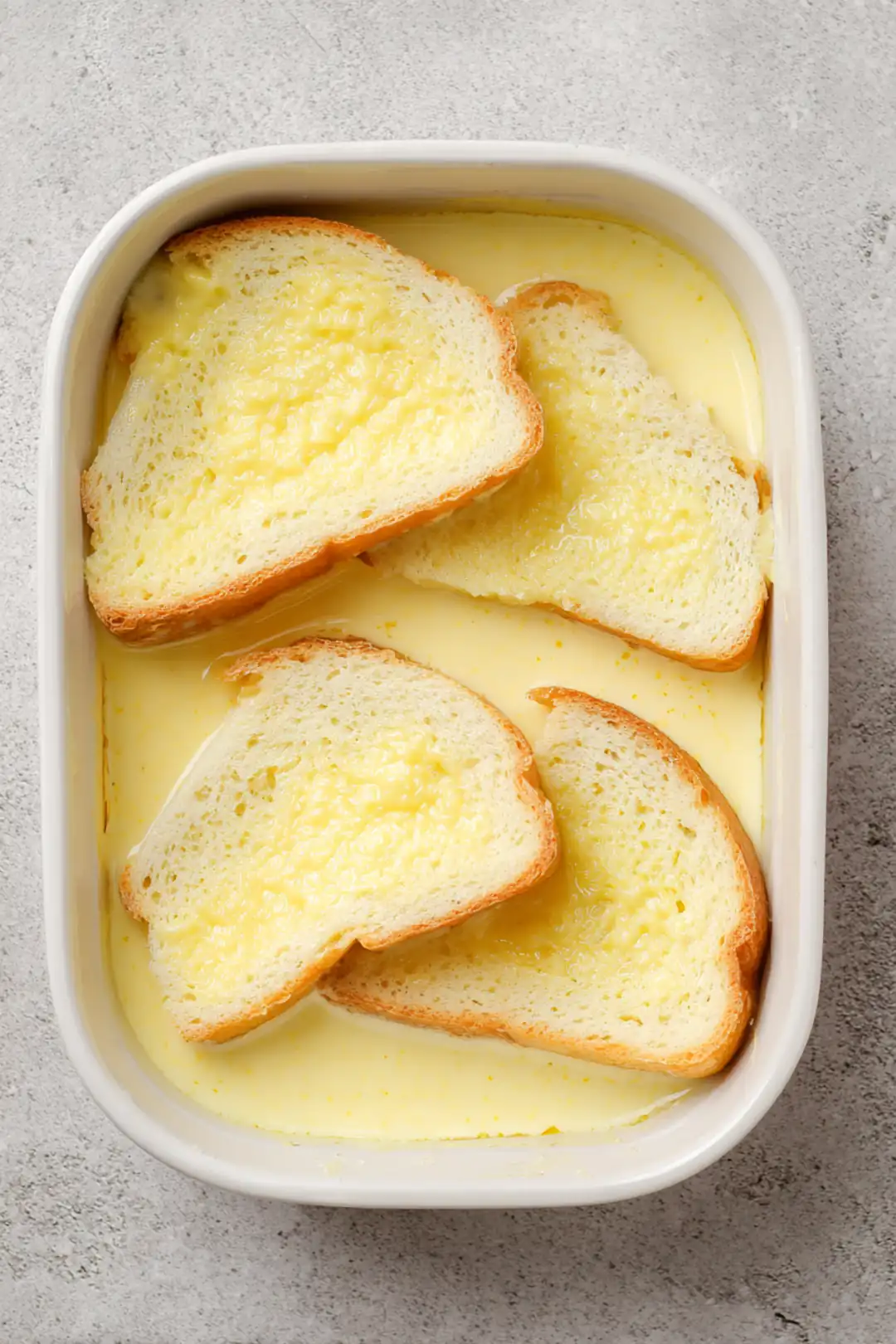 Dip each slice of bread into the custard mixture, ensuring each side is well-coated