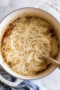 Drain the noodles and combine them with the sauce mixture, stirring well to coat all the noodles.