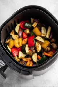 Drain the vegetables and toss them with the sauce before placing them in the air fryer.