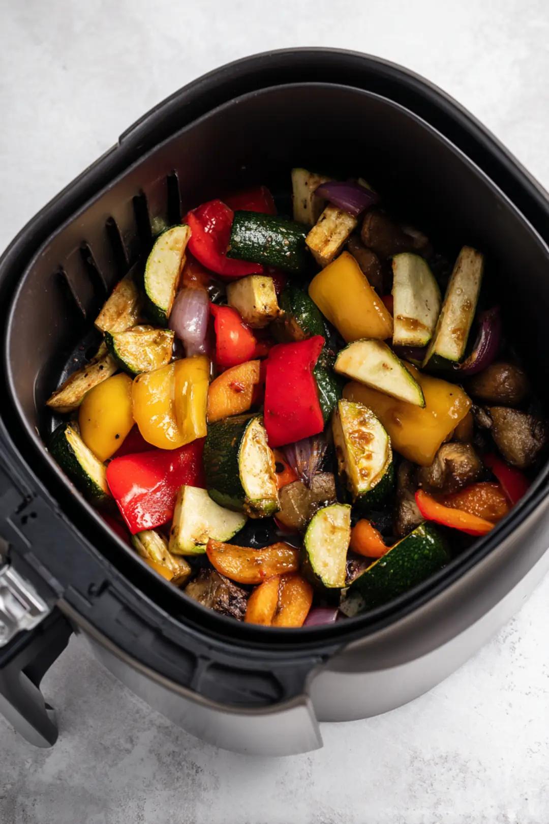 Drain the vegetables and toss them with the sauce before placing them in the air fryer.
