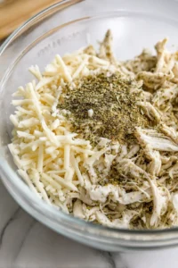 Fill mini tortillas with chicken mixture and place in air fryer