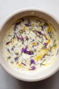 Fold in edible flowers into the butter mixture