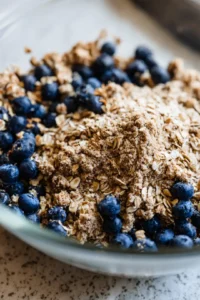 Fold in the blueberries into the oat mixture
