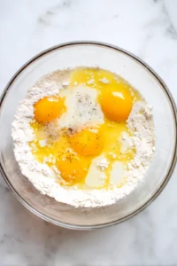 Form dough into small balls and drop into simmering broth
