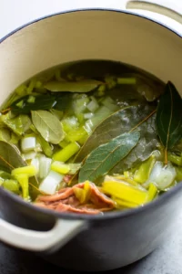 Gather vegetable scraps like onion skins, carrot peels, and celery leaves