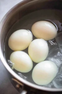 Hard boil the eggs