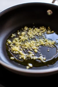 Heat olive oil and sauté garlic