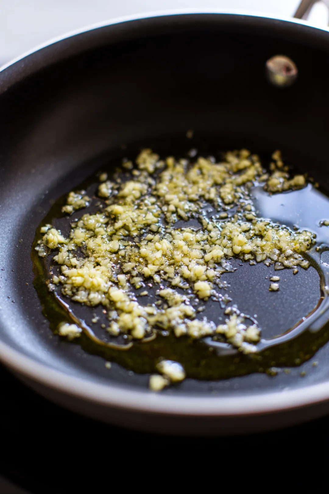 Heat olive oil and sauté garlic