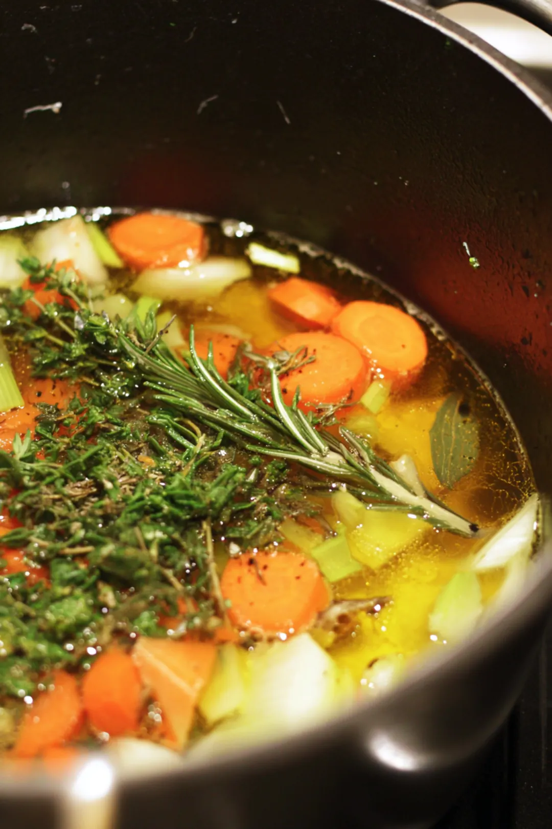 Heat the olive oil and sauté vegetable scraps until fragrant