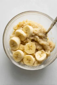 Mash the ripe bananas until smooth