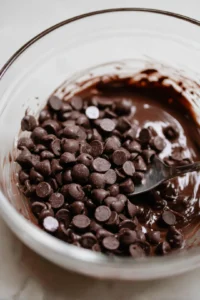 Melt dark chocolate chips in a microwave-safe bowl until smooth