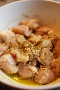 Mix chicken pieces with olive oil and seasonings
