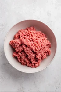 Mix ground pork with fish sauce, sugar, and soy sauce until well combined and form into slider-sized patties