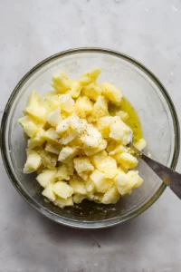 Mix in pesto sauce with smashed potatoes