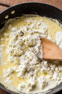 Mix in the cottage cheese and season