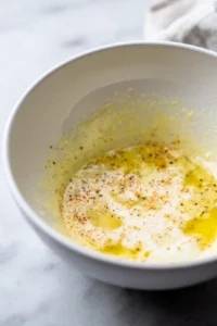 Mix the Buldak carbonara sauce, heavy cream, and sesame oil until well combined