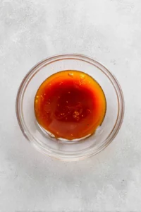 Mix together honey, hot sauce, and vinegar in a small bowl to make the hot honey sauce
