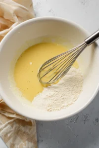 Mix wet ingredients: milk, vegetable oil, and vanilla extract until smooth