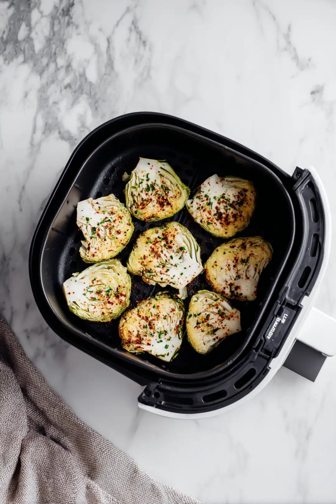 Place seasoned cabbage in air fryer