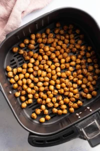 Place seasoned chickpeas in air fryer basket