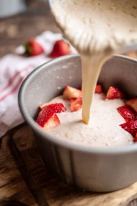 Pour cake batter into the prepared pan and smooth the top