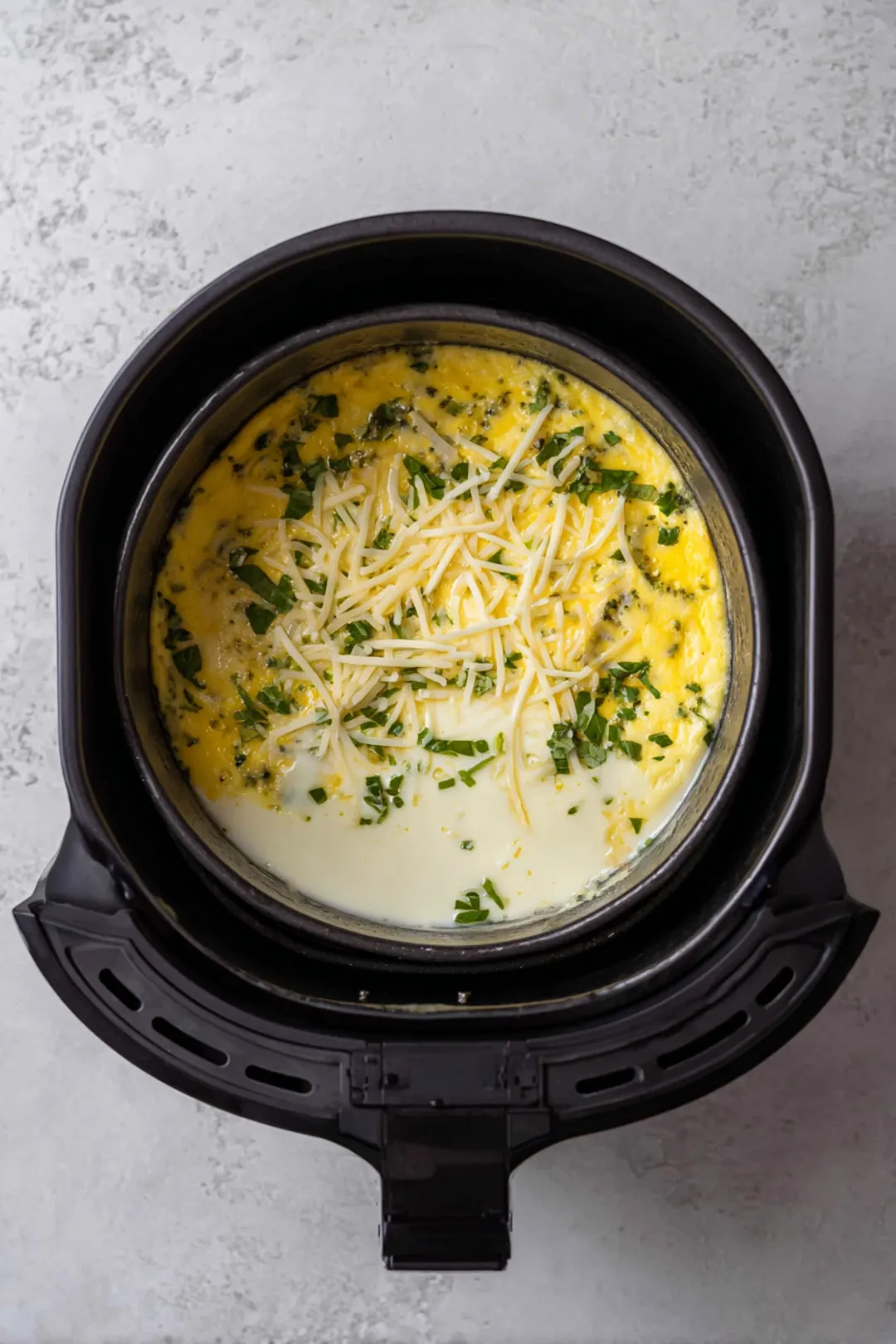 Pour frittata mixture into air fryer basket and cook