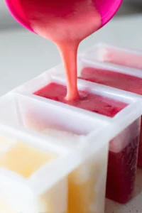 Pour the blended mixture into popsicle molds