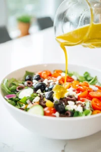 Pour the dressing over the salad and toss until all ingredients are well coated