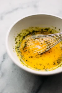 Pour the egg and pesto mixture over the toasted bagels