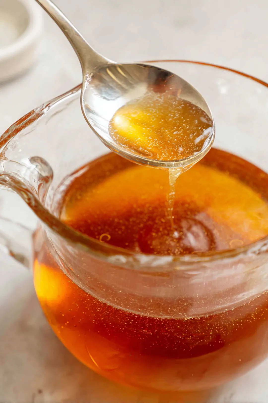 Pour the tea mixture into glasses filled with ice and garnish with lemon and mint