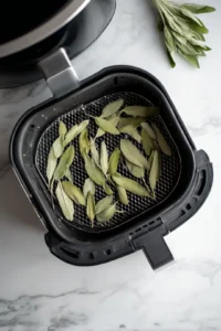 Preheat air fryer to 375 degrees Fahrenheit and arrange seasoned sage leaves in a single layer