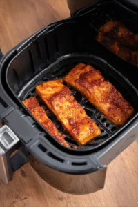 Preheat air fryer to 400°F and cook salmon