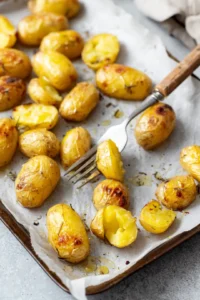Preheat oven and prepare the potatoes by smashing them