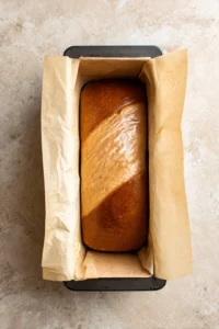 Preheat oven to 160 degrees Celsius and grease loaf tin