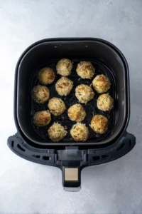 Preheat the air fryer to 375 degrees and cook coated lasagna bites for 10 minutes