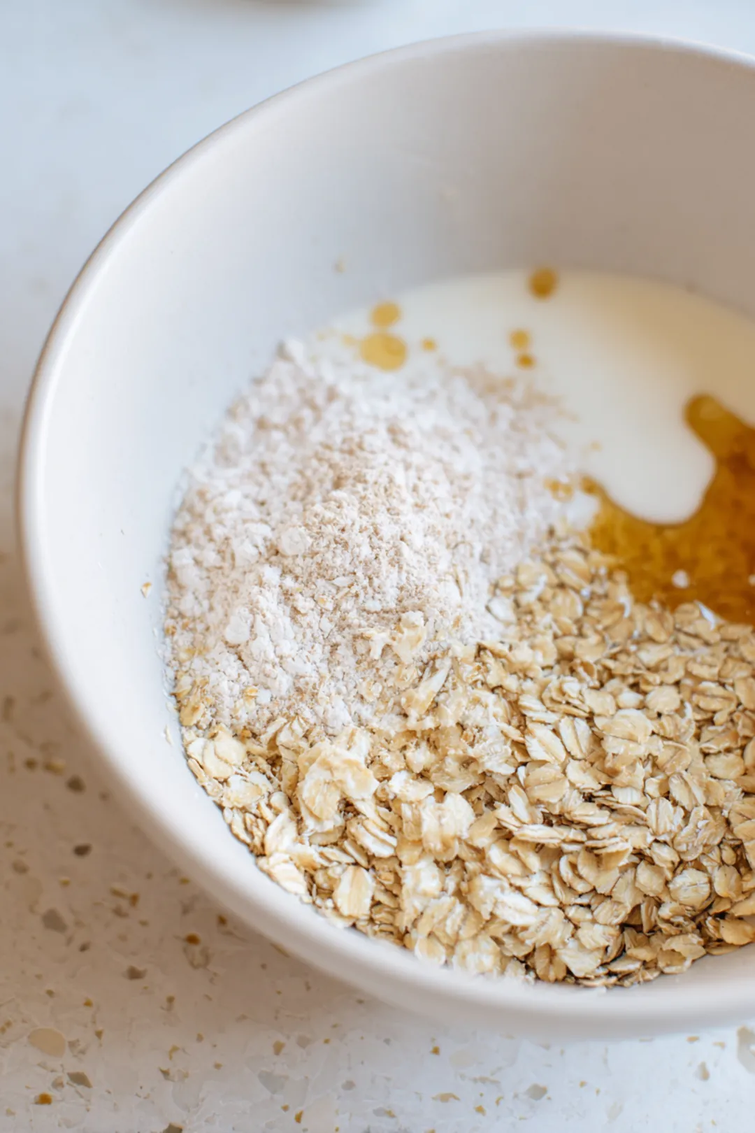 Preheat your air fryer to 320 degrees Fahrenheit and mix rolled oats, milk, honey, and baking powder