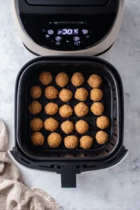 Preheat your air fryer to 375 degrees Fahrenheit and cook rice bites until golden brown