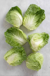 Prepare cabbage leaves by blanching them